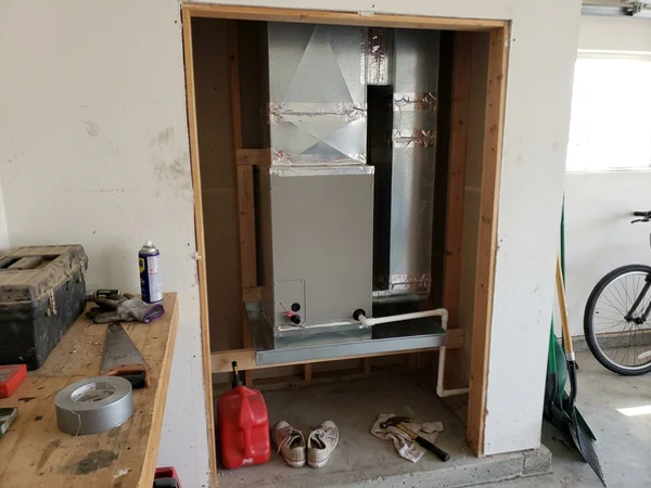 New air handler in a garage closet with a secondary drain pan