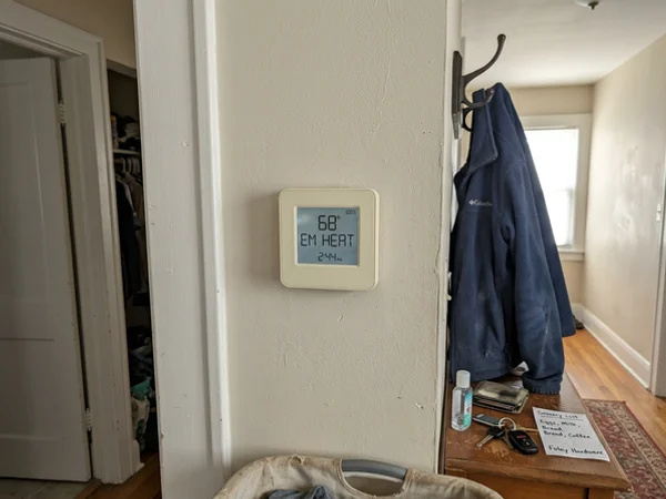 Thermostat showing the EM HEAT indicator
